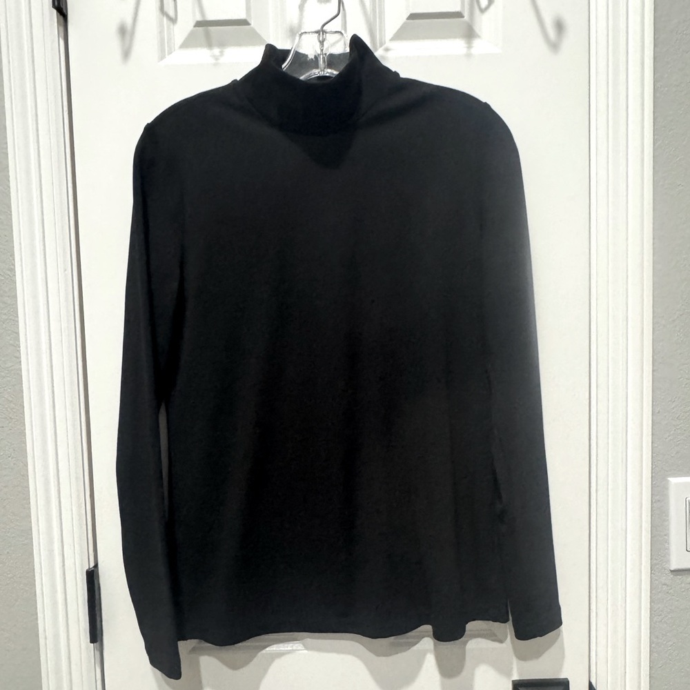 Black, zip up turtleneck. Thicker material